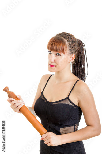 Modern housewife holding rolling pin wearing black dress