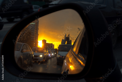 view on the car mirror on the traffic jam and sunrise © elen31