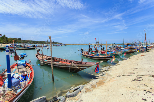 Traditional Thai boat or long tail boat stand at the beach