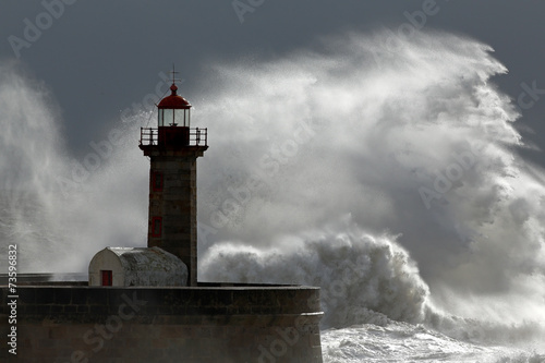 Huge wave over lighthouse