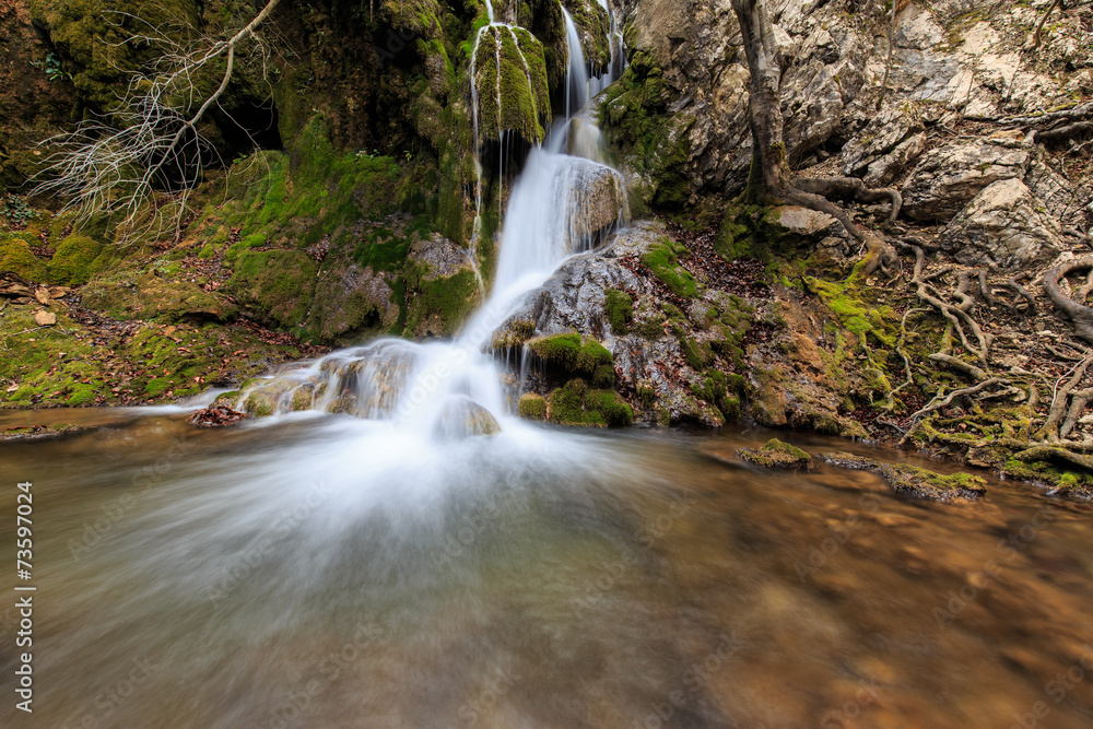 Fototapeta premium Beautiful waterfalls and autumn foliage in the forest