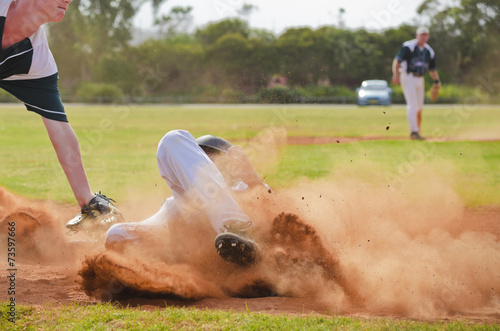 Photography Baseball player sliding into third base