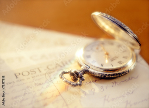 pocket watch and post card