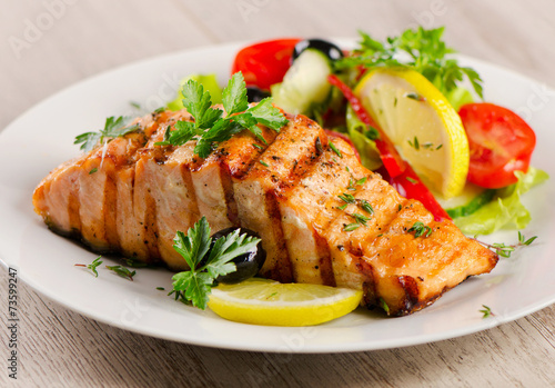 Grilled Salmon with  salad .