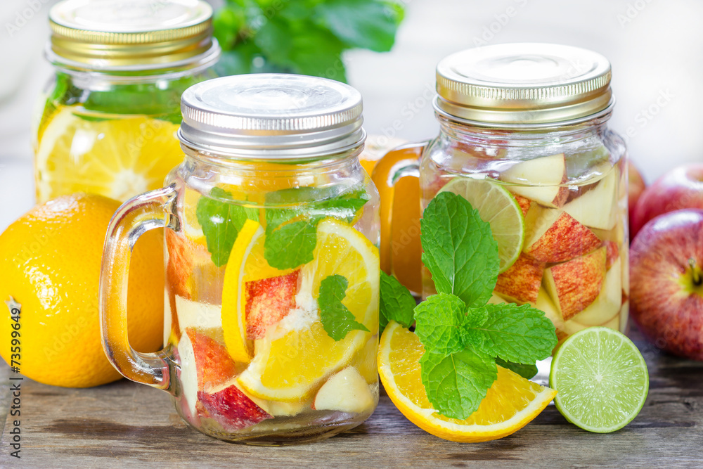 Mug delicious refreshing drink of mix fruits with mint on wooden Mug delicious refreshing drink of mix fruits with mint on wooden