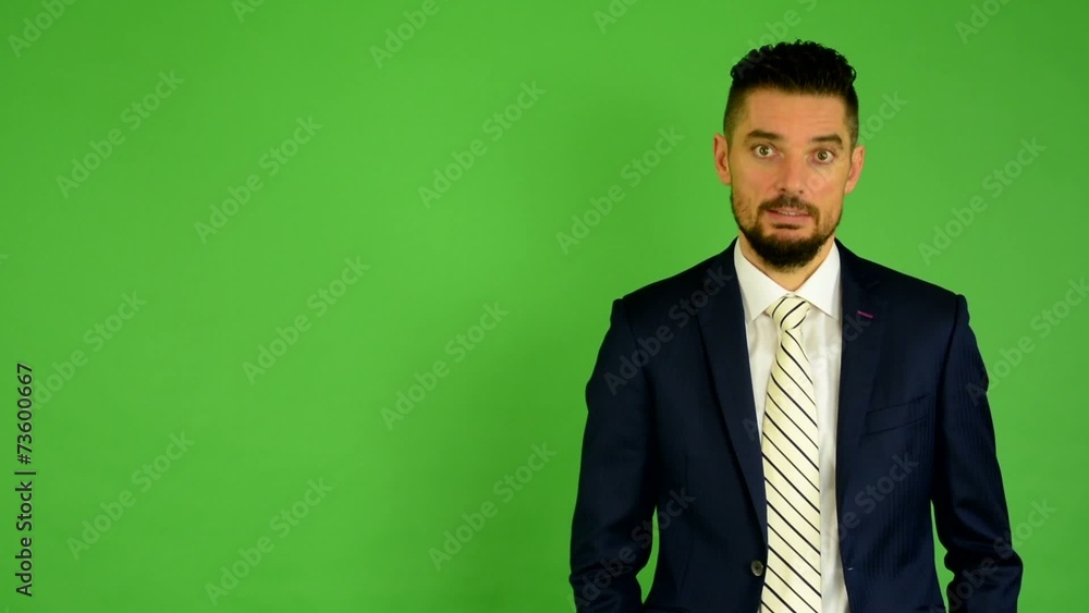 business man agrees (shakes his head) - green screen - studio business man agrees (shakes his head) - green screen - studio