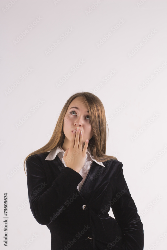 Surprised business woman looking up Surprised business woman looking up