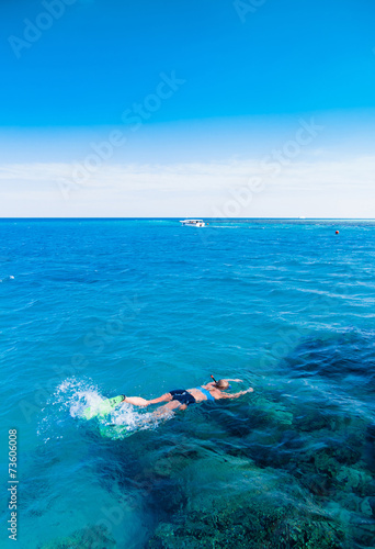 Seascape with a swimmer