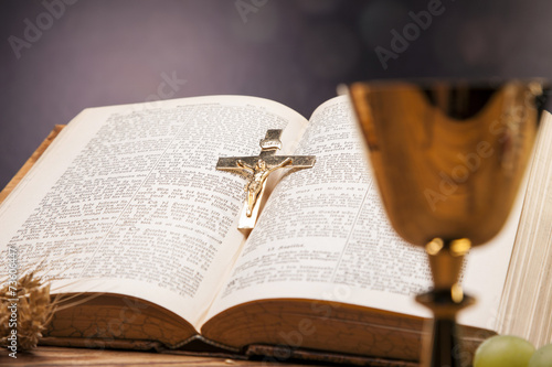 Sacred objects, bible, bread and wine.