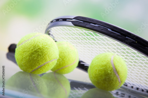 A set of tennis. Racket and ball.