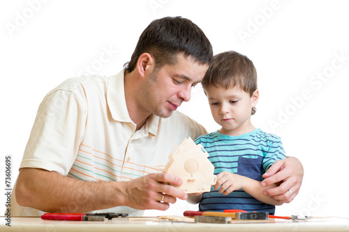 Dad and son kid teach building nesting box