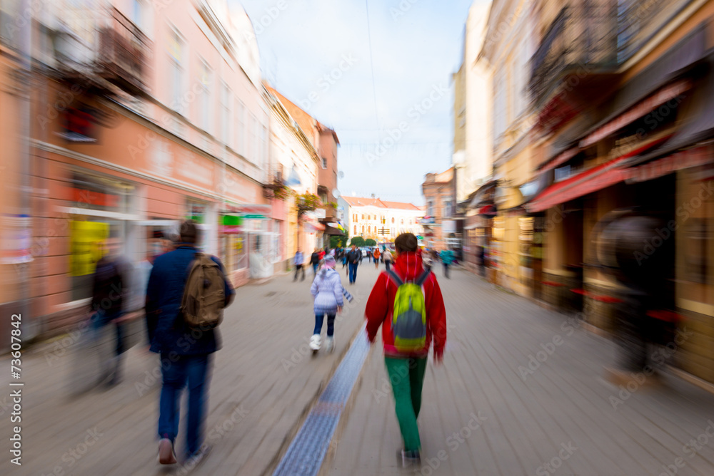 Obraz premium People going along the street