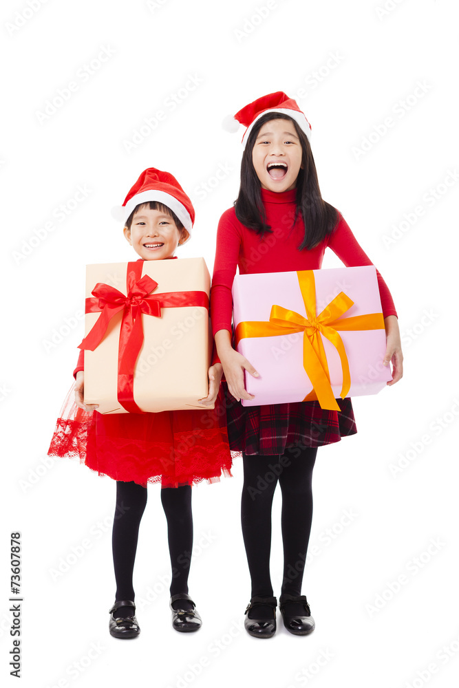 happy little girls showing christmas gift box happy little girls showing christmas gift box