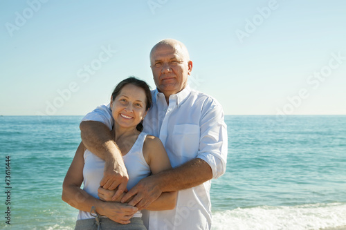 man and   woman  walking  at sea