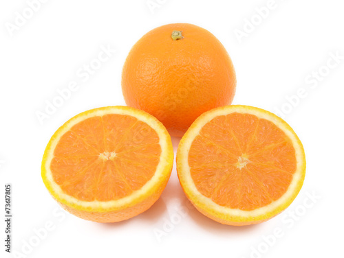 Whole orange and two juicy cut halves