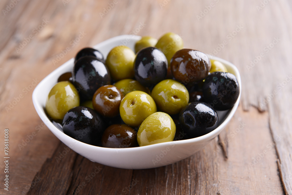 Different marinated olives on table close-up Different marinated olives on table close-up