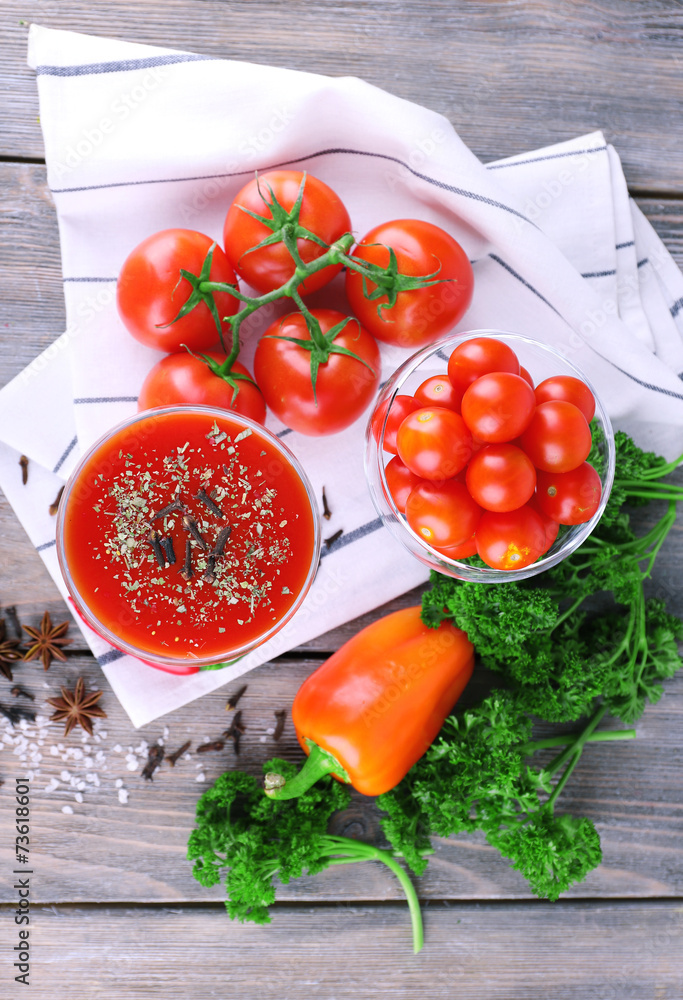 Tomato juice in goblet and fresh vegetables Tomato juice in goblet and fresh vegetables