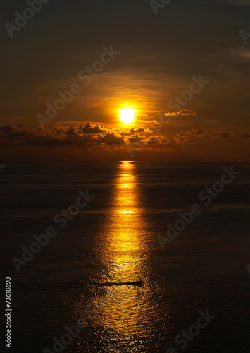 Boat in The Middle of The sea at Sunset Time