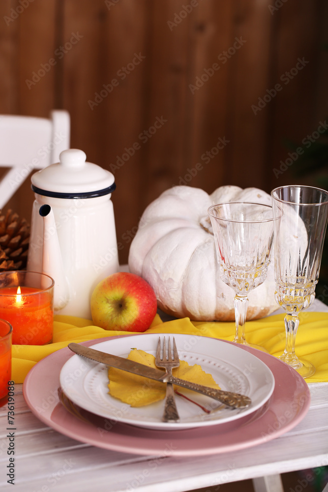 Festive autumn serving table in room Festive autumn serving table in room