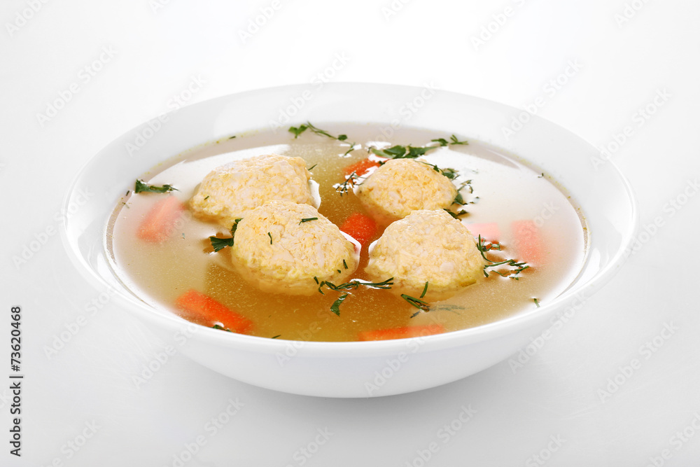 Soup with meatballs in bowl isolated on white Soup with meatballs in bowl isolated on white