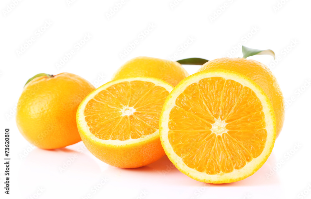 Ripe tangerines and oranges with leaves isolated on white Ripe tangerines and oranges with leaves isolated on white