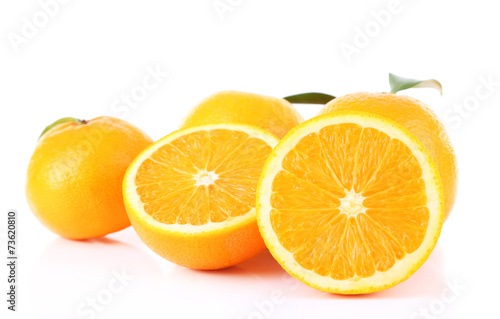 Ripe tangerines and oranges with leaves isolated on white