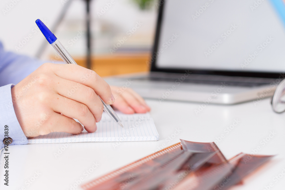 Young woman taking notes Young woman taking notes