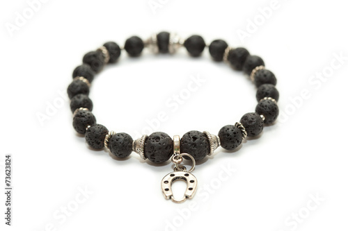 Bracelet with stones and silver pendant shaped like a horseshoe