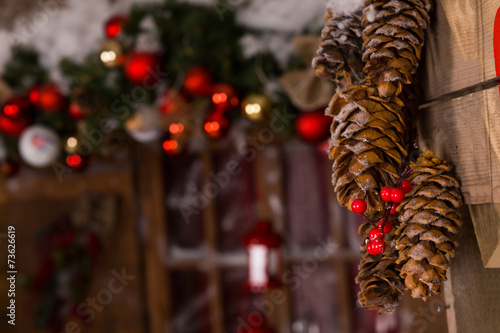 Obraz na płótnie Pine Cones Christmas Decors Hanging on Wall w salonie