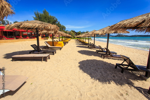 Sun umbrella and sun loungers stand at the beach in Phuket  Thai