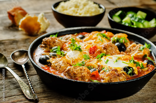 meatballs with olives and egg in tomato sauce