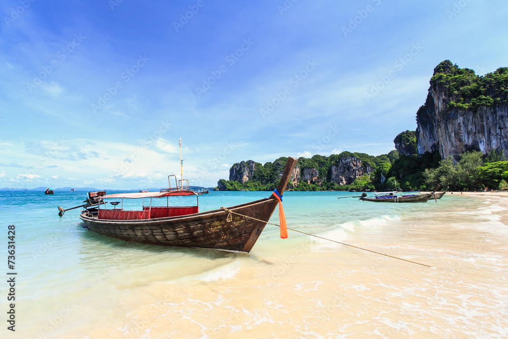 Traditional Thai boat, Long tail stand in the sea at Railay beac Traditional Thai boat, Long tail stand in the sea at Railay beac