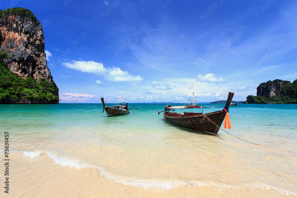 Traditional Thai boat, Long tail stand in the sea at Railay beac Traditional Thai boat, Long tail stand in the sea at Railay beac