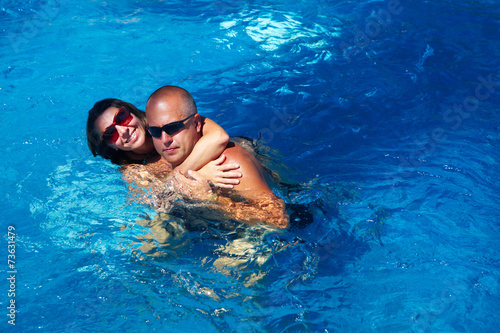 Happy couple in pool