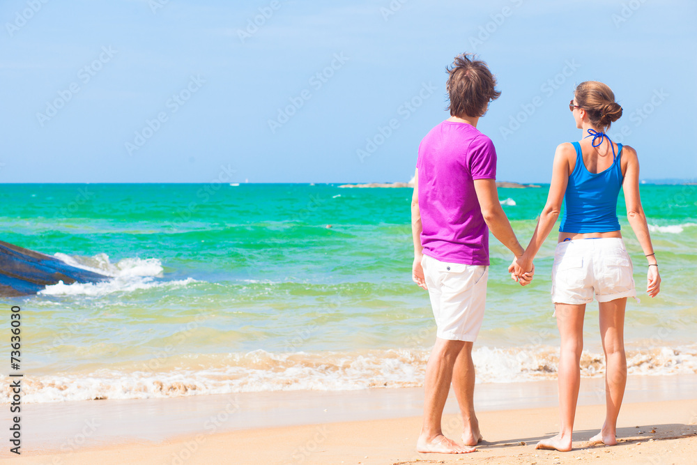 picture of happy couple in sunglasses on the beach picture of happy couple in sunglasses on the beach