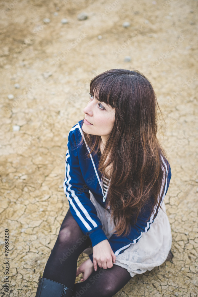 beautiful woman in a desolate landscape beautiful woman in a desolate landscape