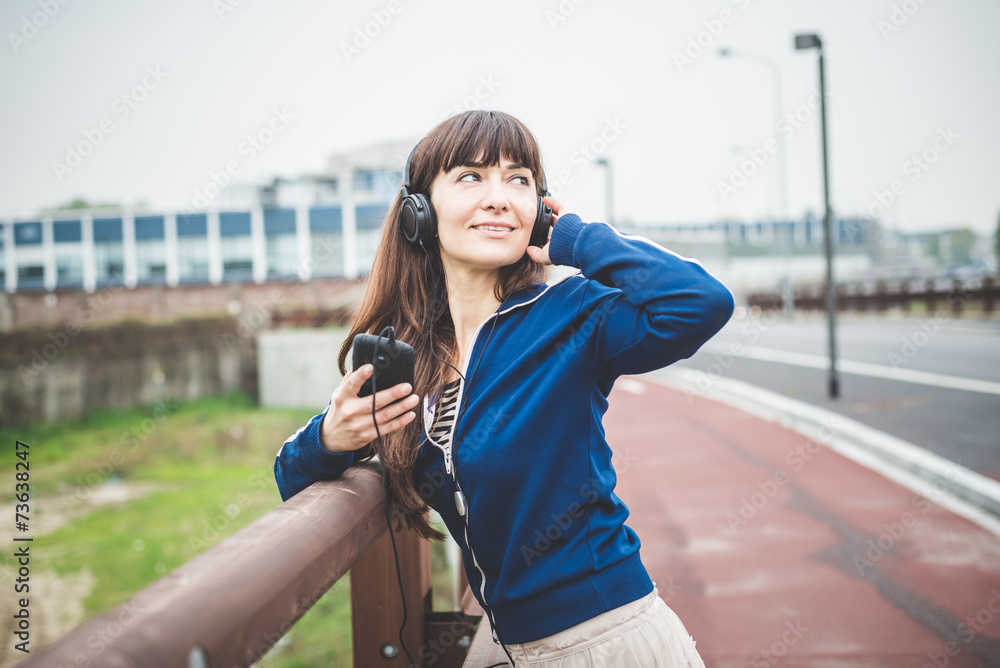 © Eugenio Marongiu - beautiful woman using smart phone and listening music