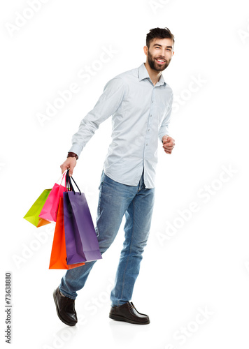 Handsome man holding shopping bags