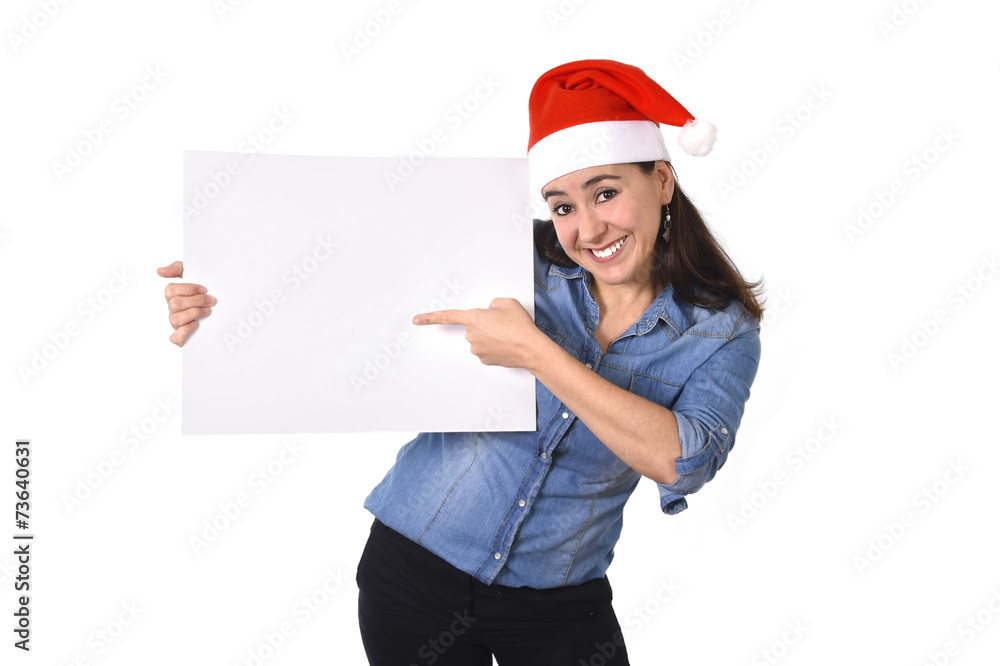 Latin woman in Santa Christmas hat pointing blank billboard Latin woman in Santa Christmas hat pointing blank billboard
