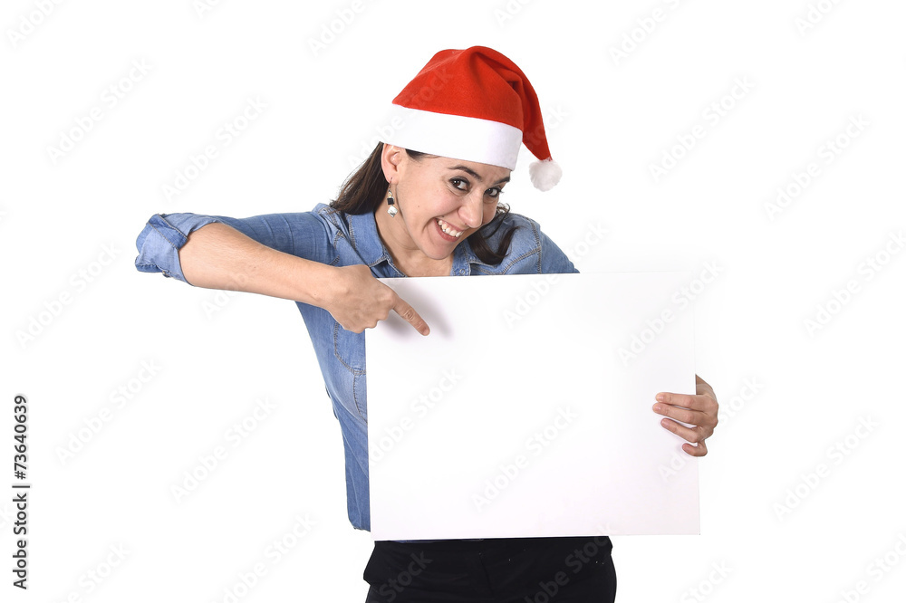 Latin woman in Santa Christmas hat pointing blank billboard Latin woman in Santa Christmas hat pointing blank billboard