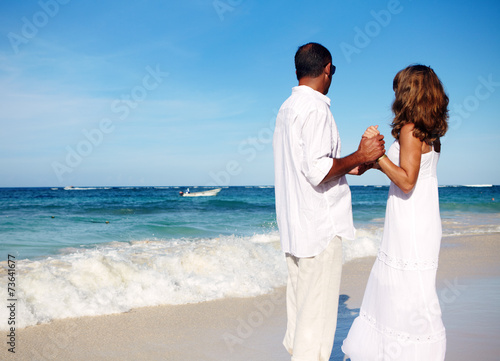 Loving couple looking the ocean © grinny