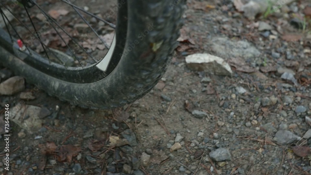Stones flying away from mountain bicycle in slow motion Stones flying away from mountain bicycle in slow motion