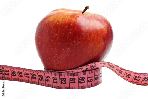 Diet concept - red apple and measuring tape