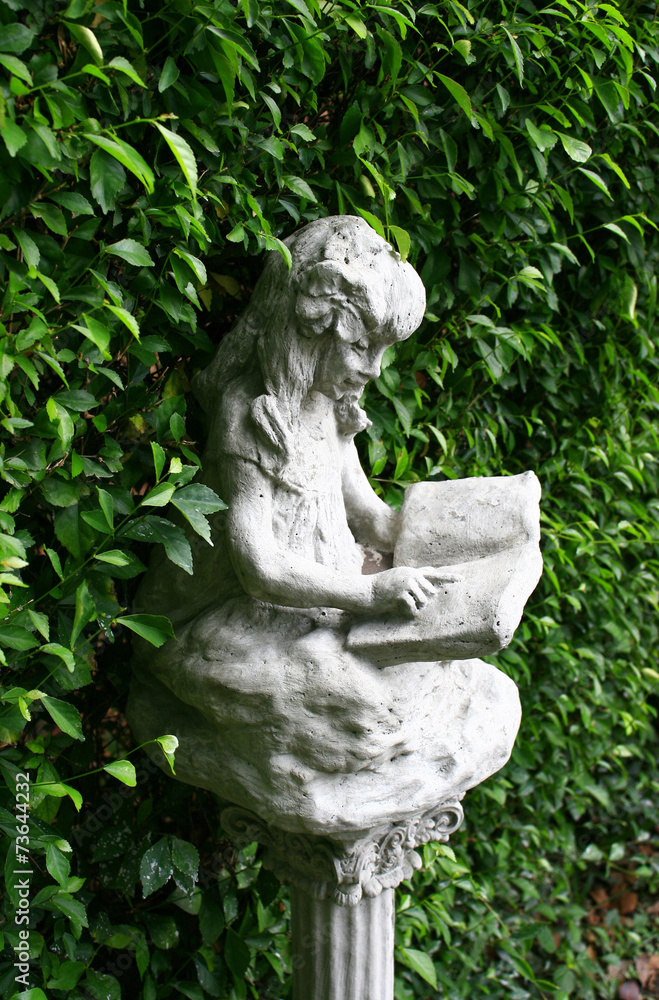 Children statue and green background Children statue and green background