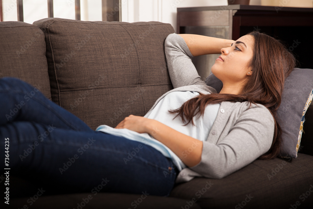 Laying on a couch at home Laying on a couch at home