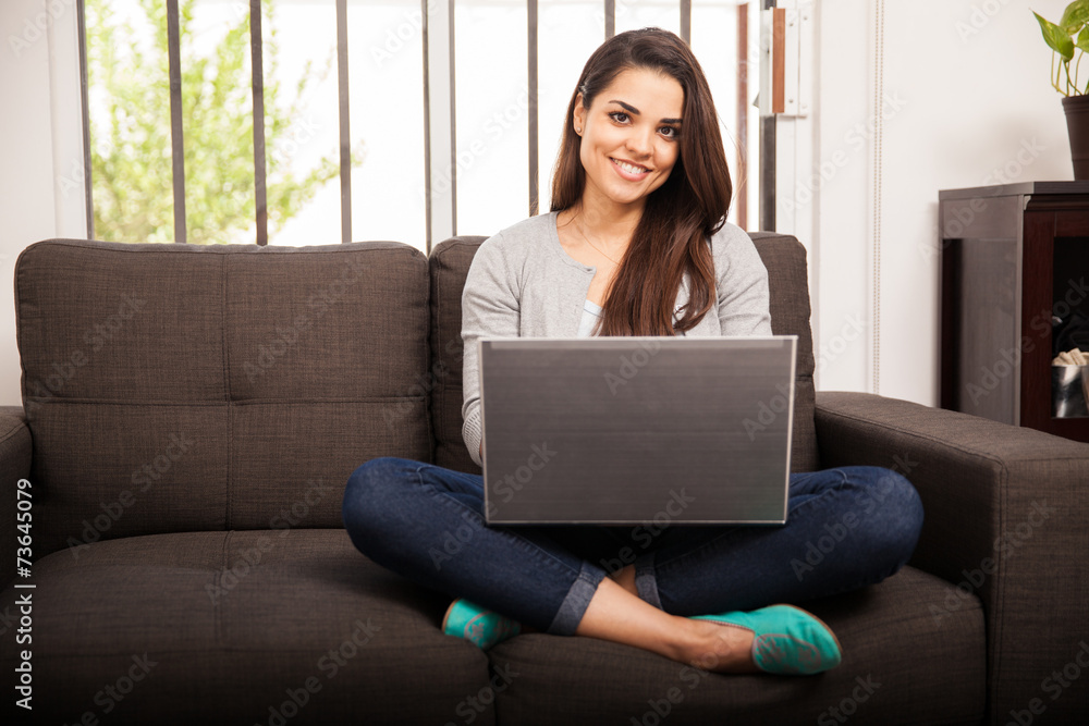 Beautiful woman using a laptop at home Beautiful woman using a laptop at home