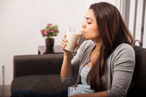 Taking a sip of milk at home