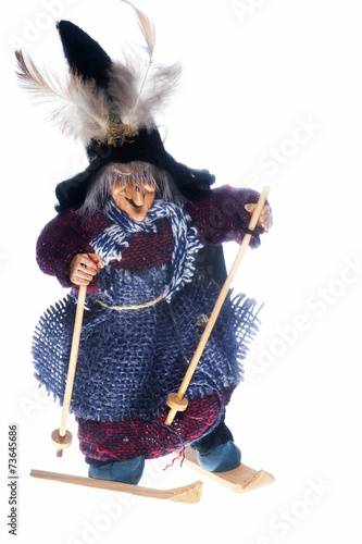 epiphany witch with skis on a white background