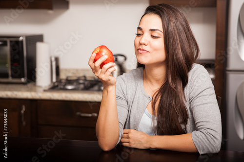 Eating an apple at home