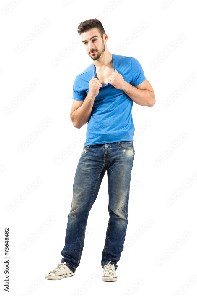 Young fashion model pulling t-shirt neckband Young fashion model pulling t-shirt neckband